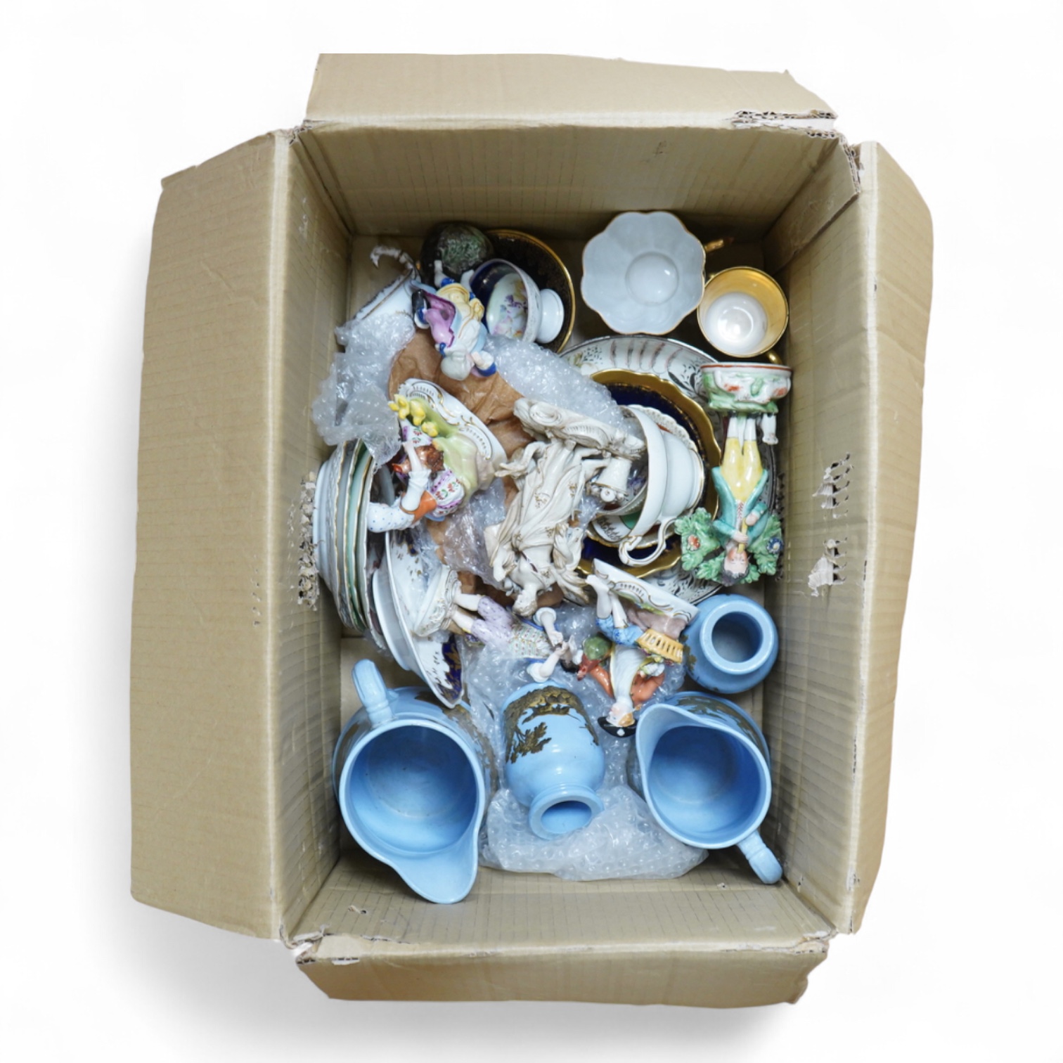 A collection of mixed ceramics including a Dresden figure and cabinet cups and saucers